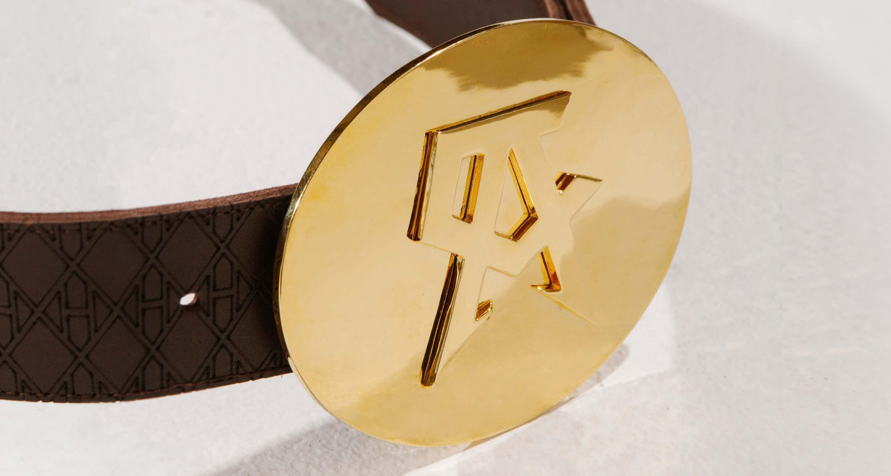 A stylish leather belt with a 14 karat gold buckle signature to Canelo Alvarez.