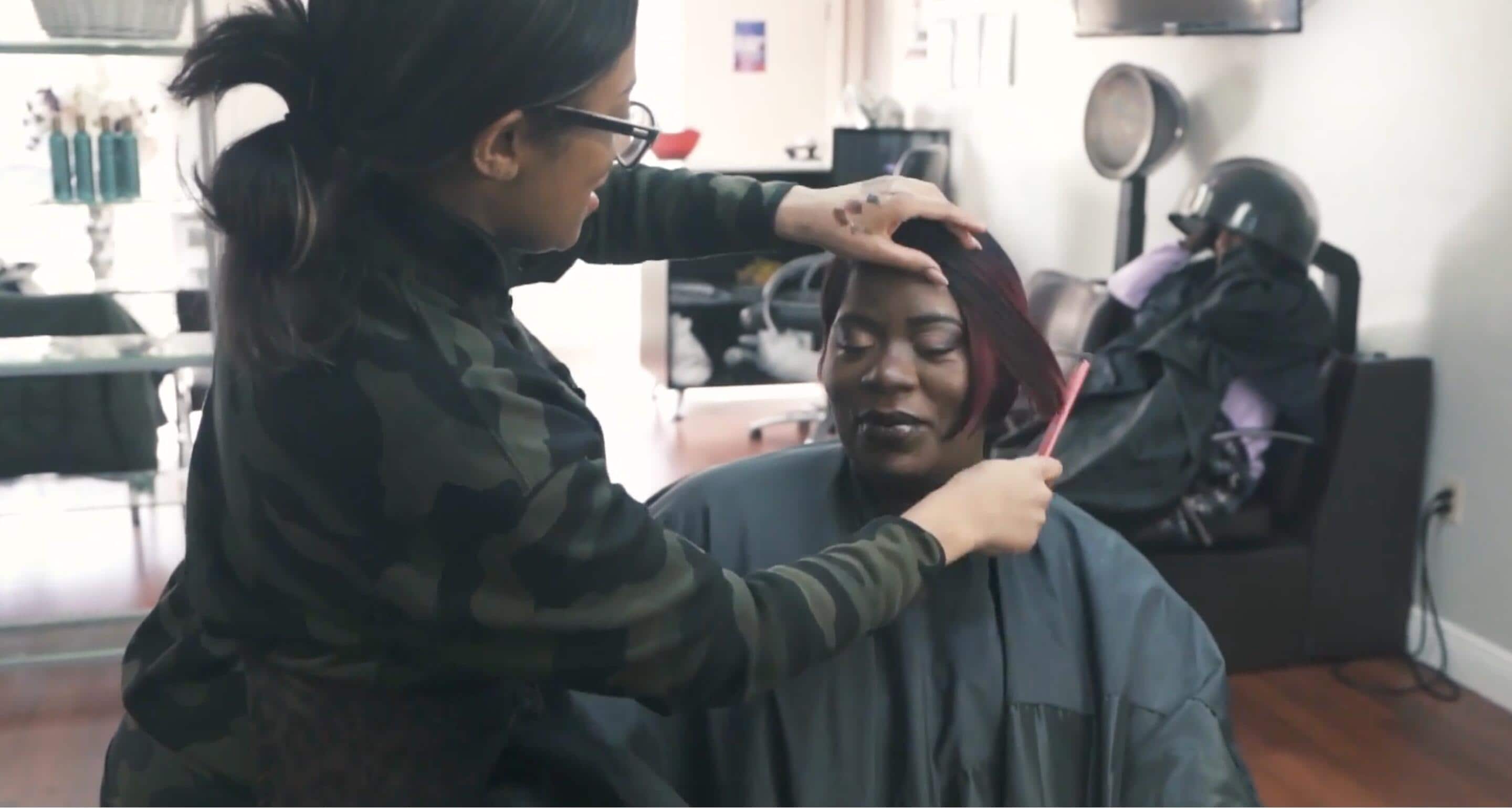 Image of participant receiving a haircut.
