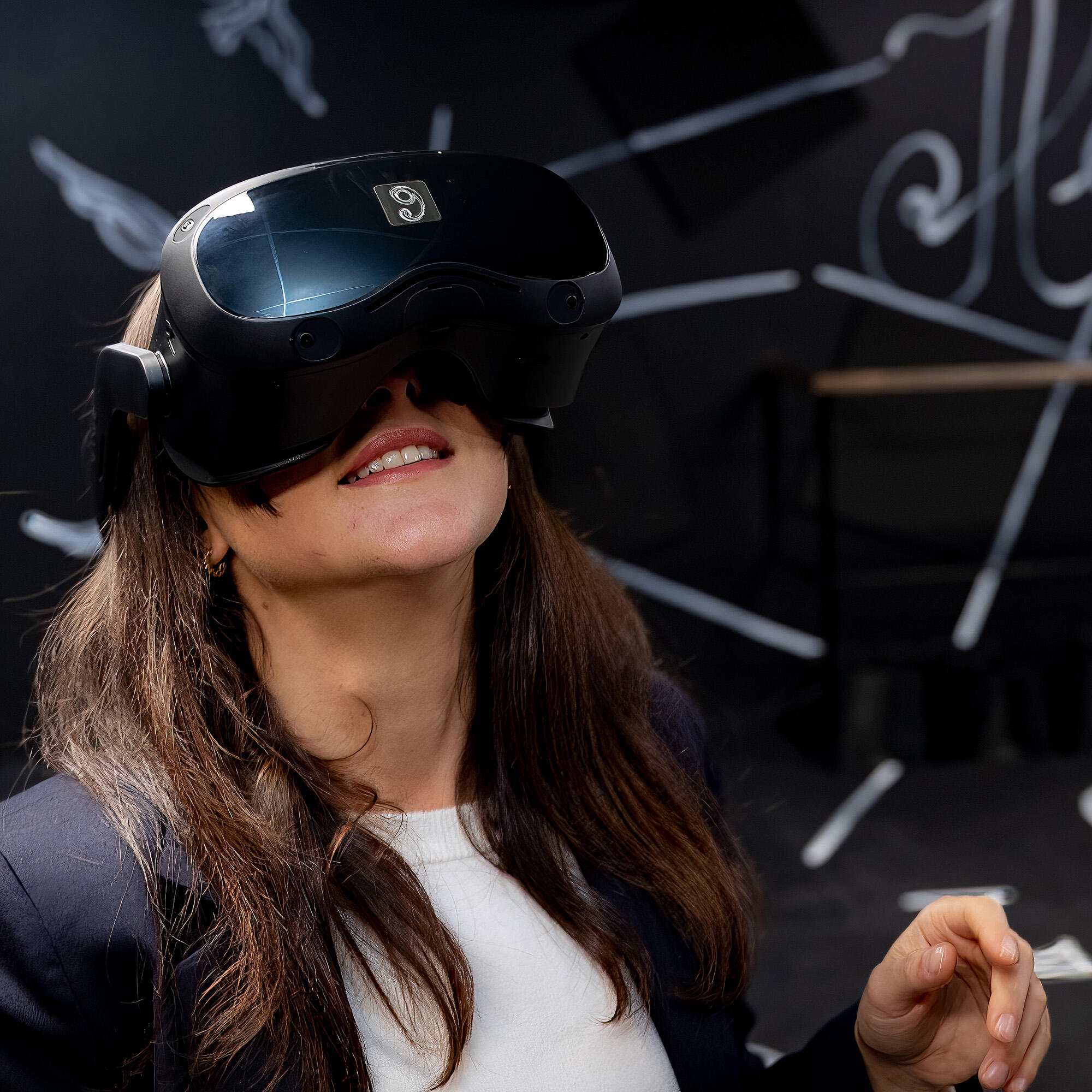 A visitor with a virtual reality headset on, experiencing our immersive experience, MOBILIS