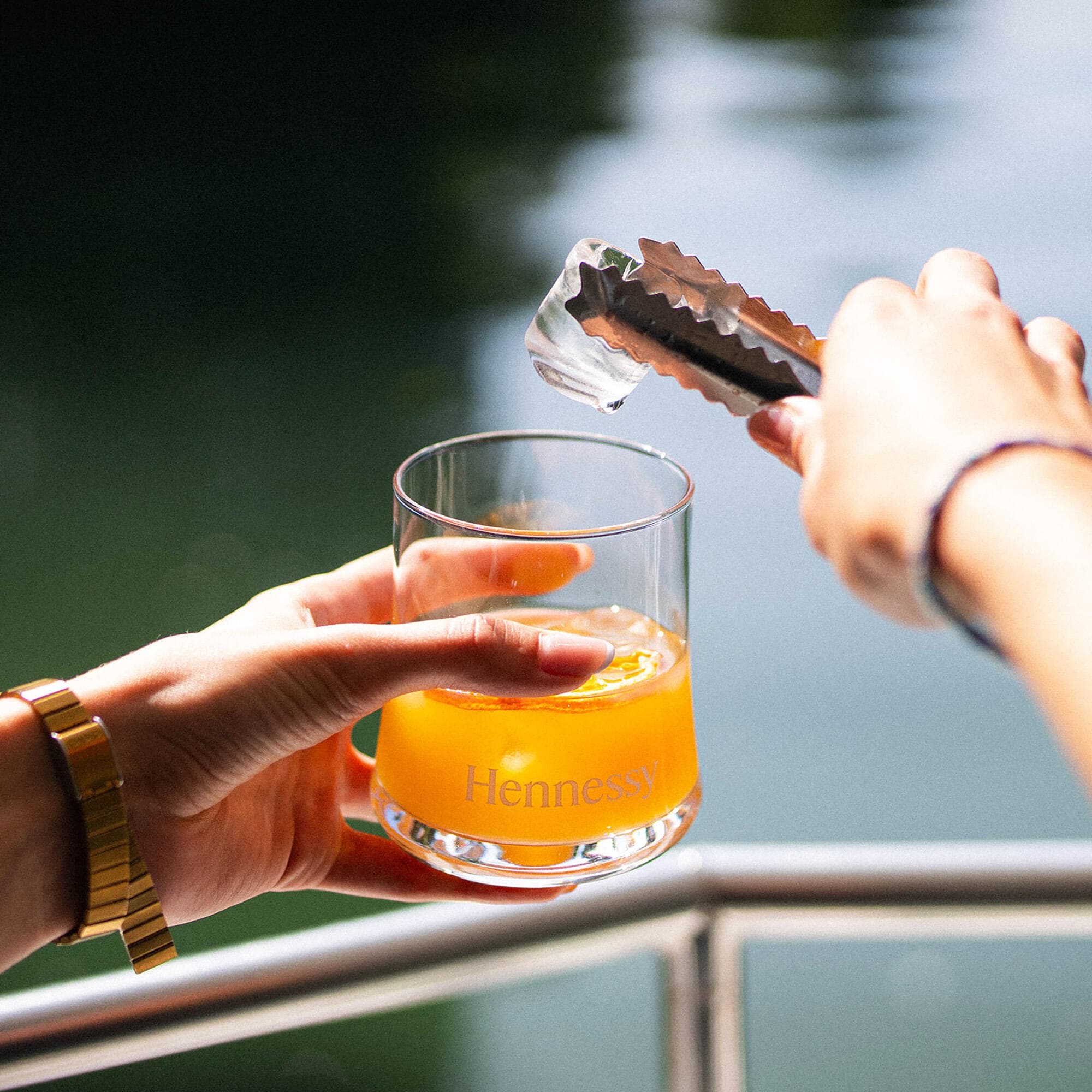 A colourful cognac-based cocktail is being served by a professional guide on board the Hennessy boat during the Hennessy Flash Tour